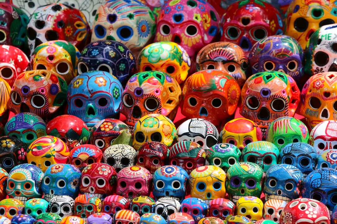 A selection of bright calaveras on display of Cinco de Mayo. You can explore these further in some of our best Mexican slots.
