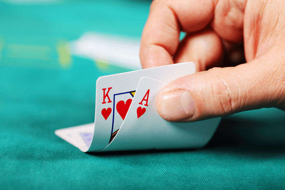 A hand showing 2 cards on a poker table